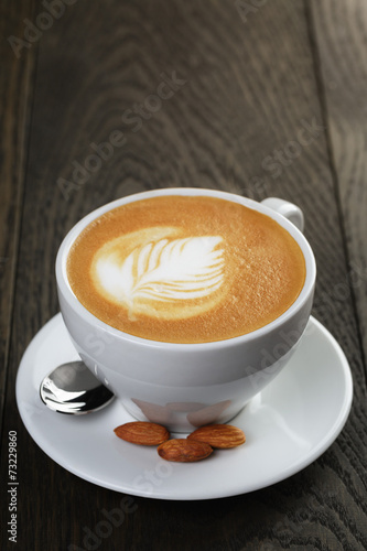Fototapeta na wymiar cup of fresh cappuccino with latte art