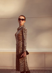 Wall Mural - Street fashion concept - pretty elegant woman in leopard dress a