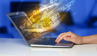 man typing on modern notebook with number technology data coming