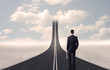 © ra2 studio - Businessman looking at 3d road that goes up in the sky