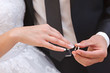 © lexuss - Hand of the groom and the bride with wedding rings at a wedding