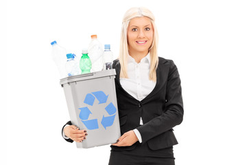 Wall Mural - Businesswoman holding a recycle bin