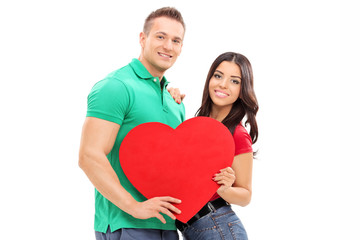 Sticker - Young couple holding a red heart