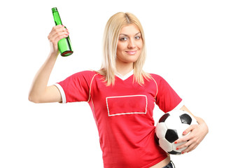 Poster - Young female fan holding a beer bottle and football