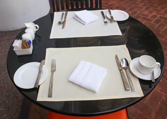 View of a coffee terrace with tables and chairs