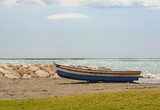 Fototapeta Miasto - Small fishing boat on Spanish Beach