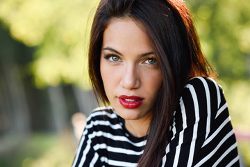 Young woman with green eyes wearing young clothing