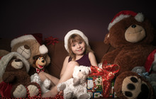 Beautiful Girl With A New Year's Gift And Soft Toys