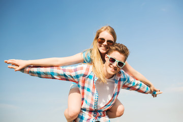 Wall Mural - smiling couple having fun outdoors