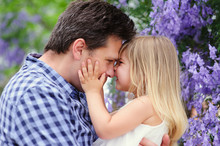 Young Father And His Cute Daughter Love In Blooming Garden