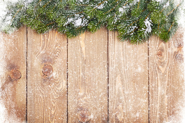 Wall Mural - Old wood texture with snow and firtree