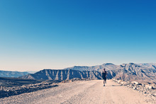 Shot Of A Man Running On Mountain Road