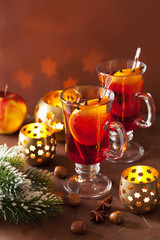 Wall Mural - glass of mulled wine with orange and spices, christmas decoratio