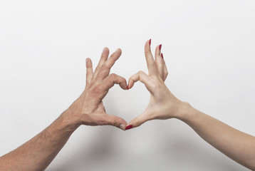 Wall Mural - Couple hands making heart gesture