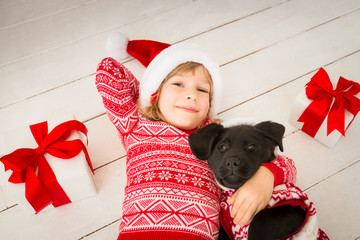 Canvas Print - Child and dog in Christmas