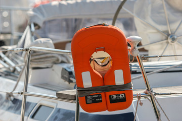 Wall Mural - orange life jacket on a boat