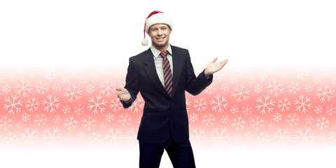 Poster - young business man in santa hat showing empty space over winter