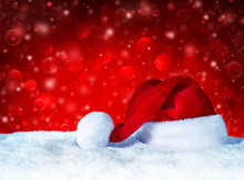 Santa Claus Hat With Snow And Red Snowfall Background