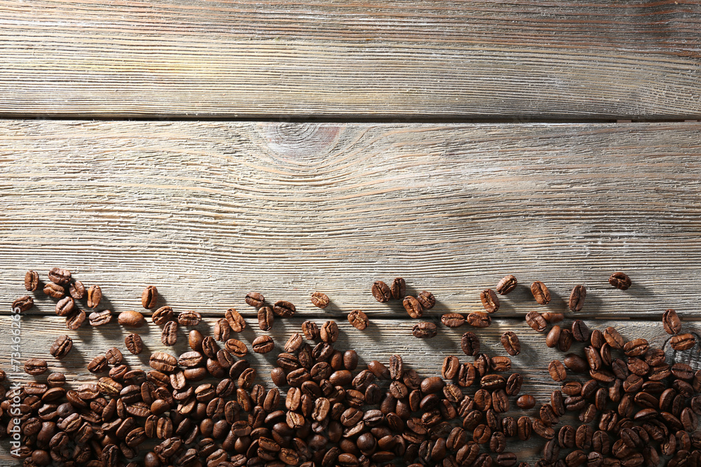 Coffee beans on wooden background