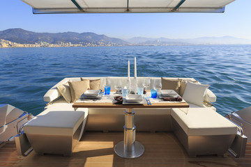 lunch on motor yacht, table setting at a luxury yacht.