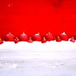 canvas print picture - rote Weihnachtskugeln im Schnee