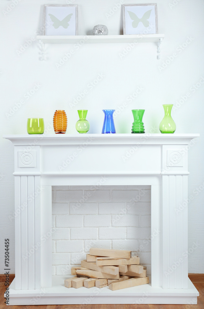 Fireplace with beautiful decorations in comfortable living room