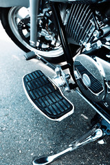 Detail with the foot-rest of motorcycle