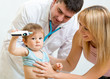 © Oksana Kuzmina - Pediatrician doctor examining child. Mother holding baby.
