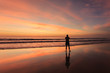 © SKT Studio - Silhouette of tourist at sunset beach in Phuket Thailand