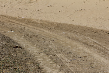 footprints in the sand on cars