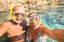 Senior Happy Couple Taking A Selfie At Blue Lagoon In Malta