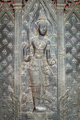 Wall Mural - Traditional Thai door carving in temple