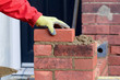 Bricklaying - laying a brick