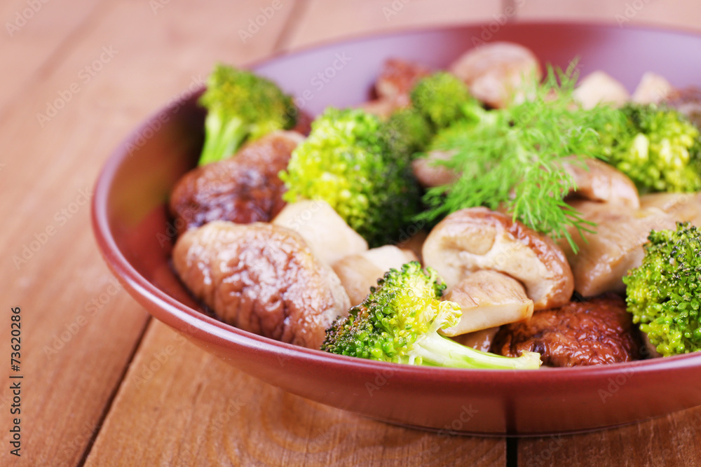 Braised wild mushrooms with vegetables and spices in plate