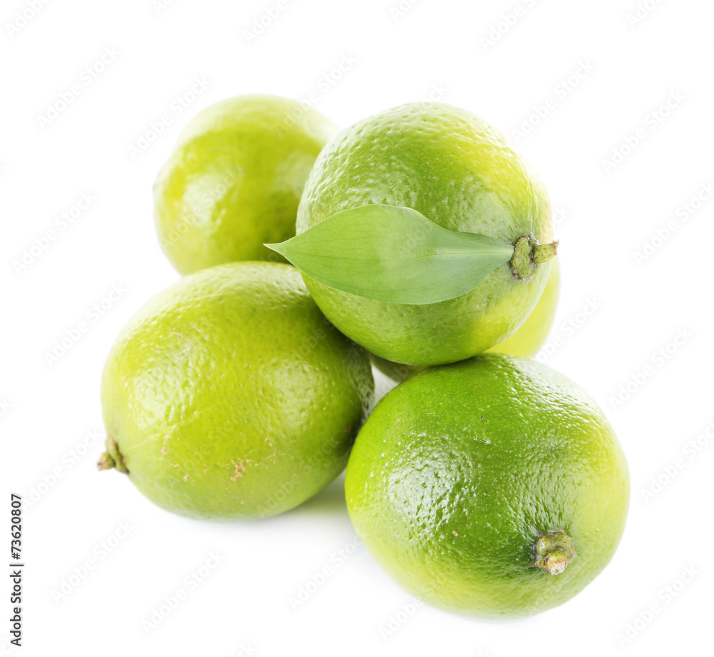 Fresh juicy limes isolated on white