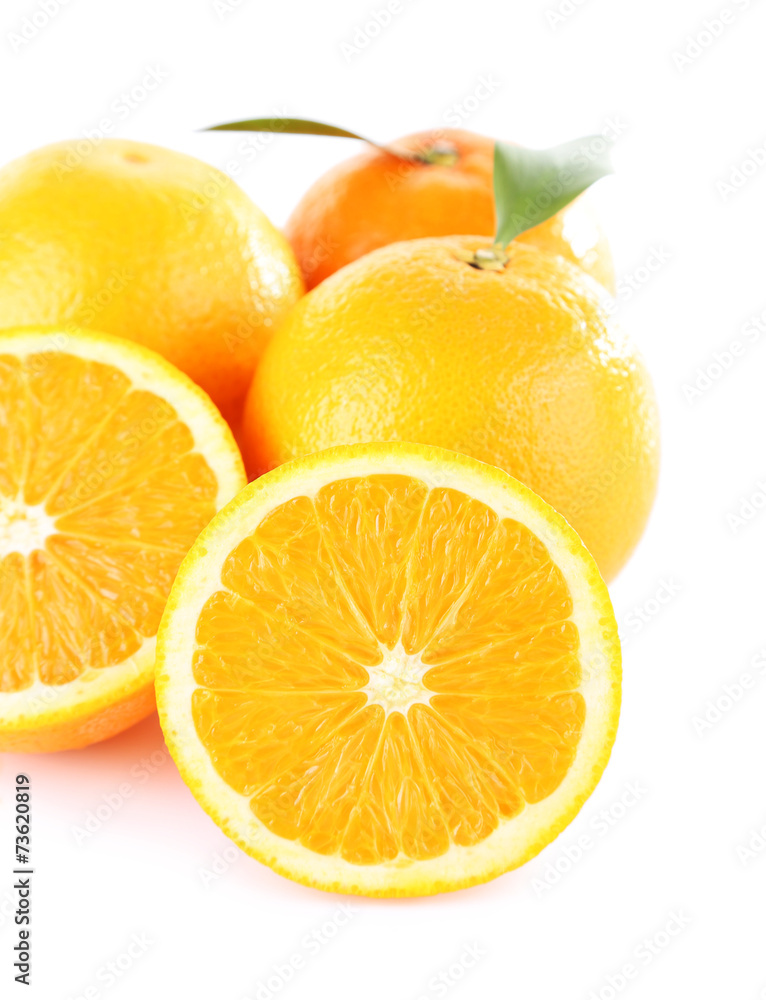 Ripe tangerines and oranges with leaves isolated on white