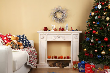 Canvas Print - Beautiful Christmas interior with sofa, decorative fireplace