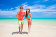 © el.rudakova - Couple walking and having fun on a tropical beach at Maldives
