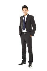 Wall Mural - full length young smiling businessman standing