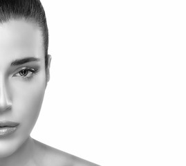 Wall Mural - half flawless face of young pretty woman in monochrome