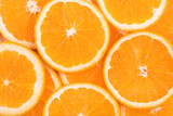 Fototapeta Tęcza - background of orange slices
