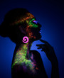 © chettythomas - Woman sensual posing in fluorescent paint makeup