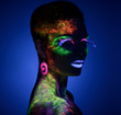 © chettythomas - Woman sensual posing in fluorescent paint makeup