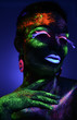 © chettythomas - Woman sensual posing in fluorescent paint makeup