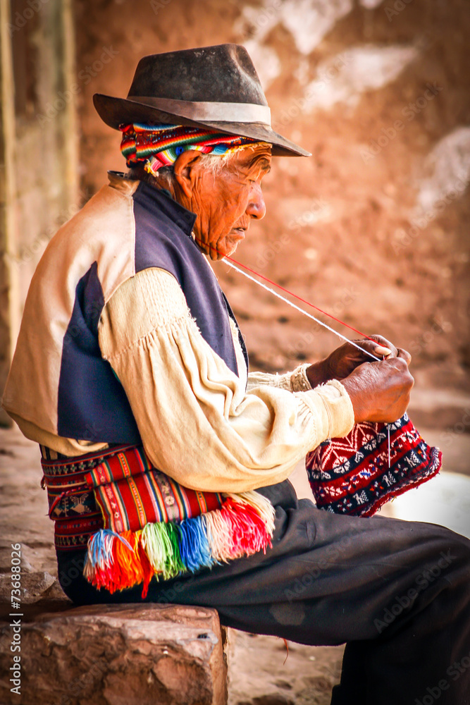 Old men knitting at taquile island in puno peru - obrazy, fototapety, plakaty 