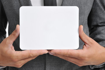 Poster - man in suit holding a blank signboard