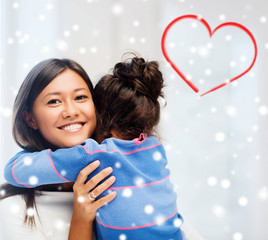 Poster - smiling little girl and mother hugging indoors