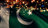 Fototapeta  - Pakistan National Flag Light Night Bokeh Abstract Background