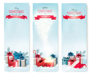 Poster - Three Christmas banners with presents. Vector.