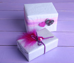 Two gift boxes on wooden background